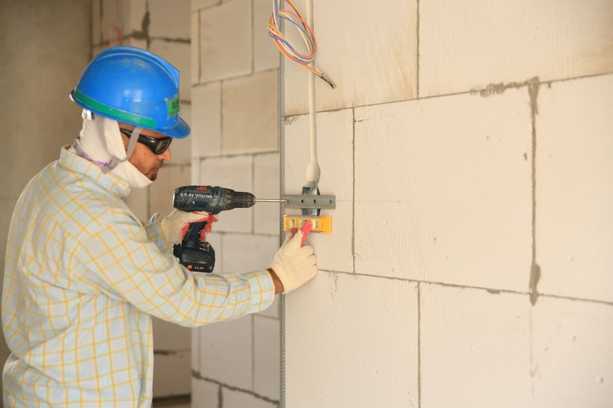 Drilling-into-wall